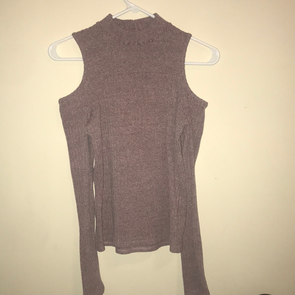 A lavender, off the shoulder, long sleeve top.